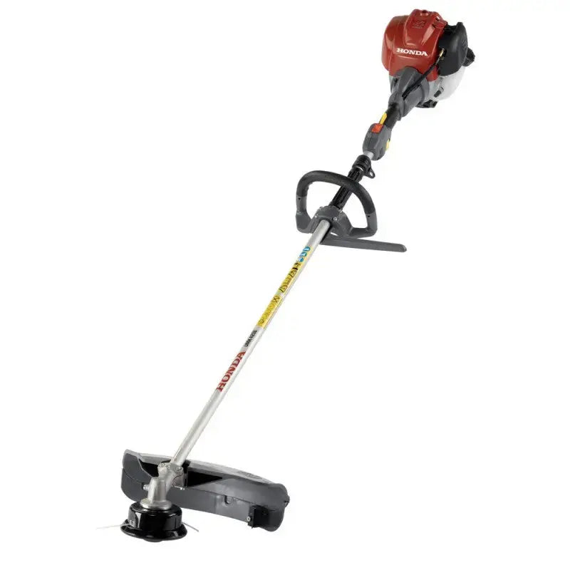 Débroussailleuse HONDA UMK 435 E LE moteur 4 temps GX35, 35 cm³, portage anneau avec prolongateur. Polyvalente, anti-vibration, livrée avec tête à fils, harnais et lunette.