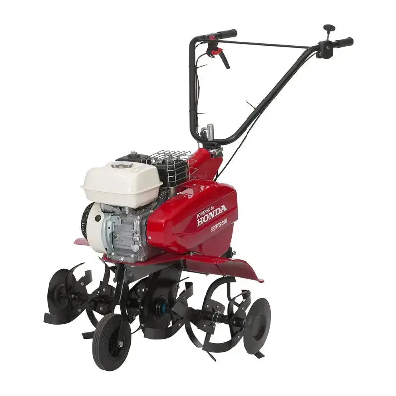 Motobineuse HONDA FG 320 compacte avec moteur 4 temps 163 cm³, guidon réglable, fraises de broyage et grande largeur de travail pour potager. Idéale pour labourer et sarcler efficacement.